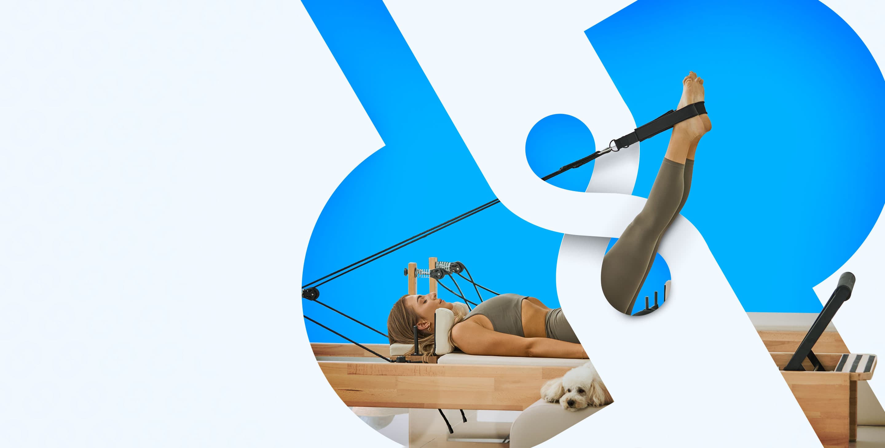 A member training on a Pilates reformer
